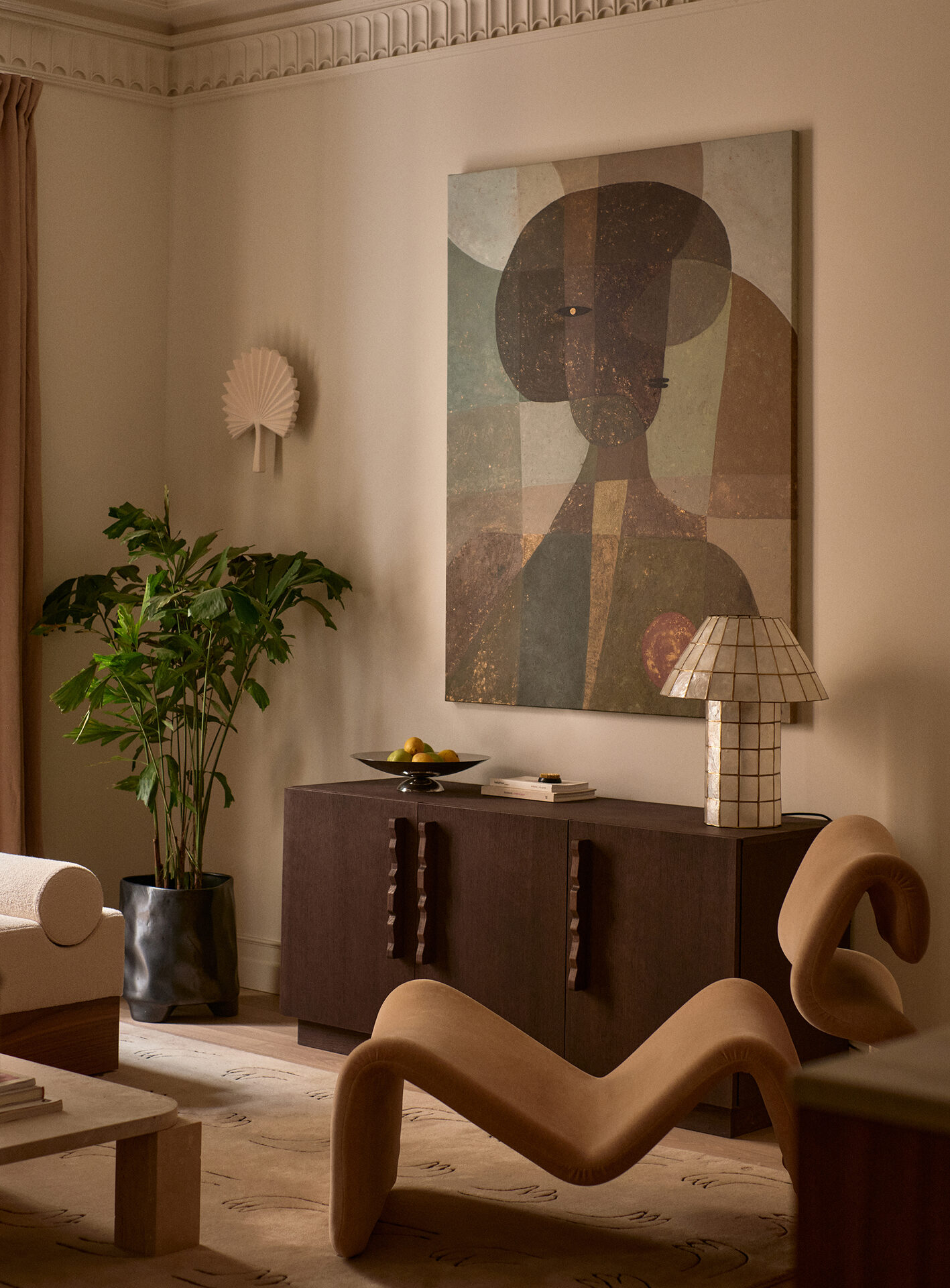 Sitting room detail with sideboard and plant