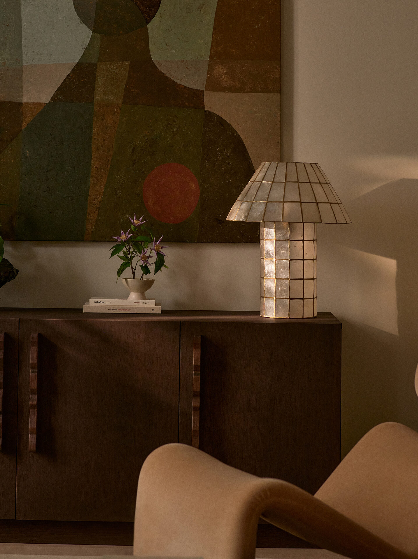 Painting, lamp and sideboard detail