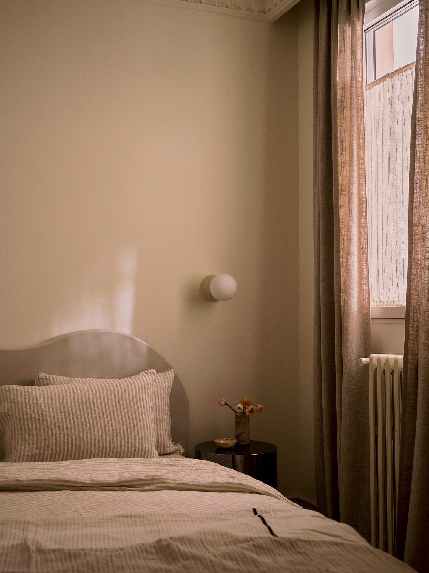 Second bedroom with radiator and linen