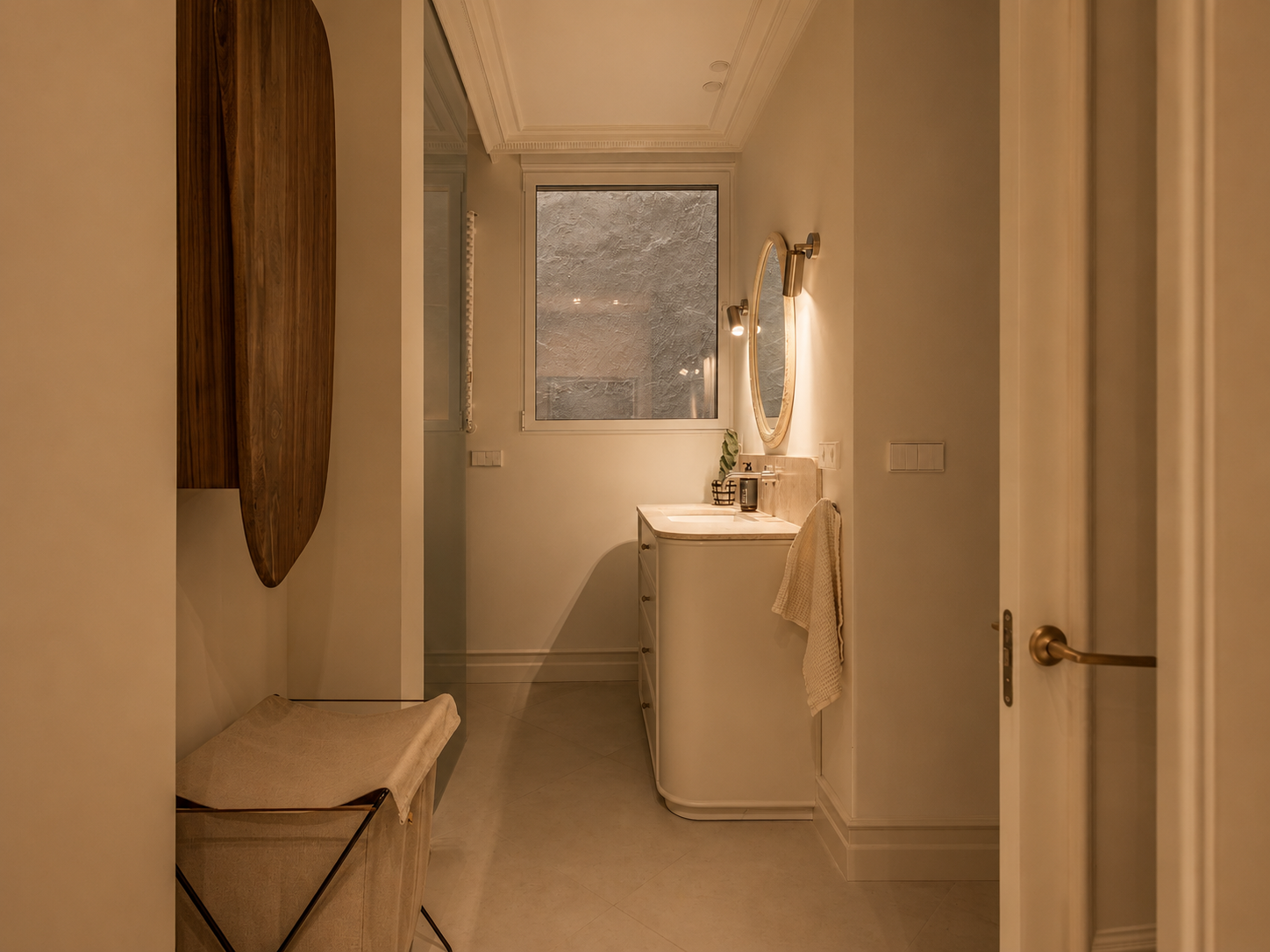 Second bathroom with travertine vanity and oval mirror