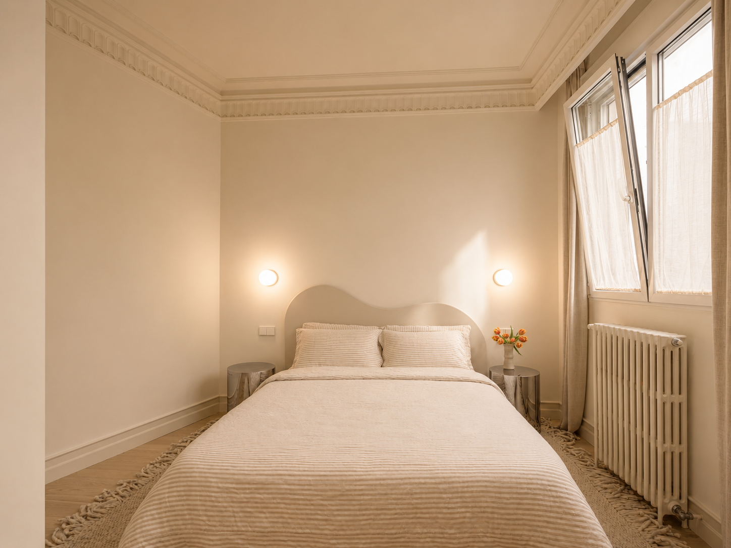 Spare bedroom with sculpted headboard and linen bedding